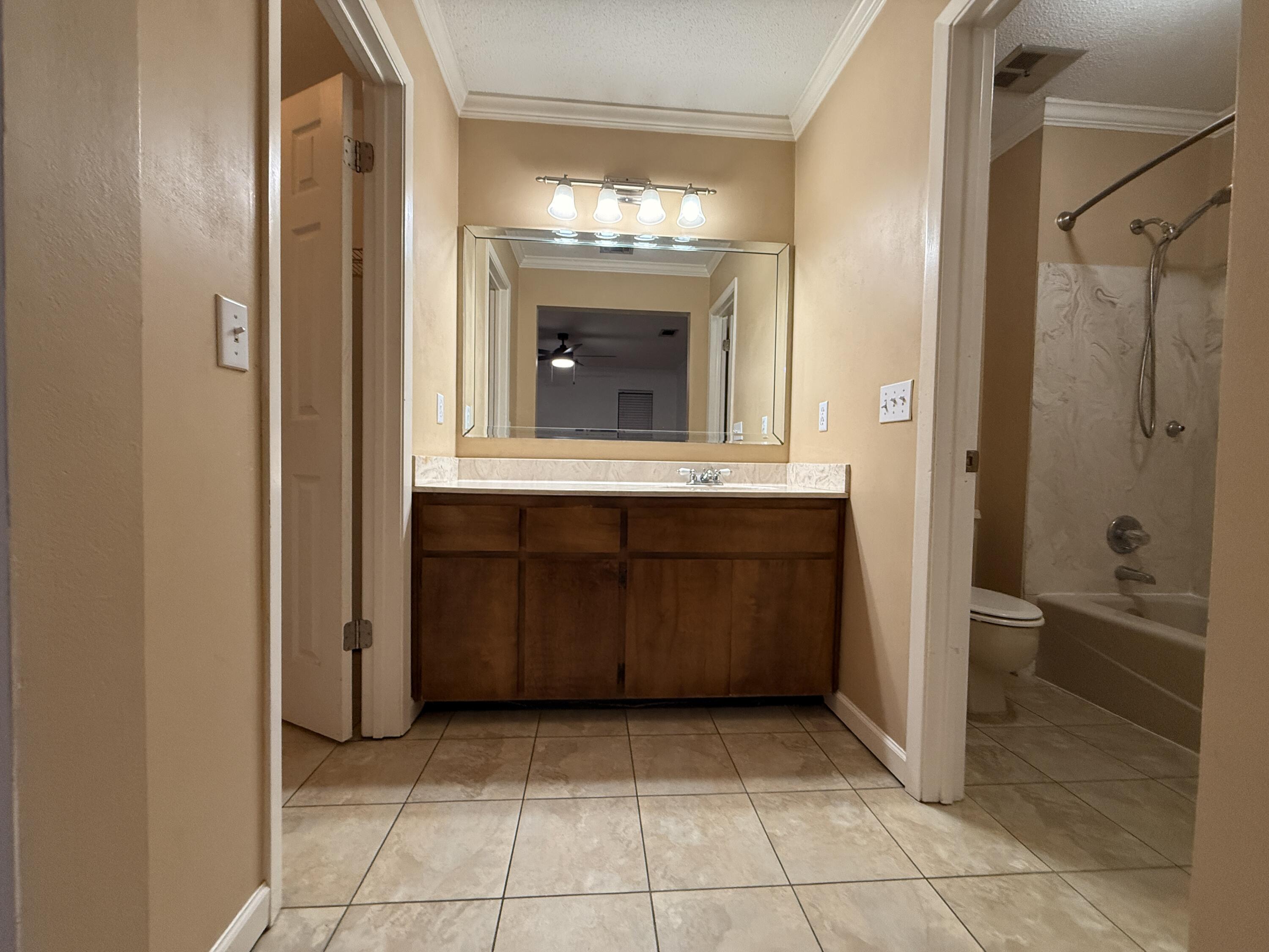 1054 9th Street Shalimar, FL 32579 - Photo 28 of 45 a view of a bathroom with mirror and shower