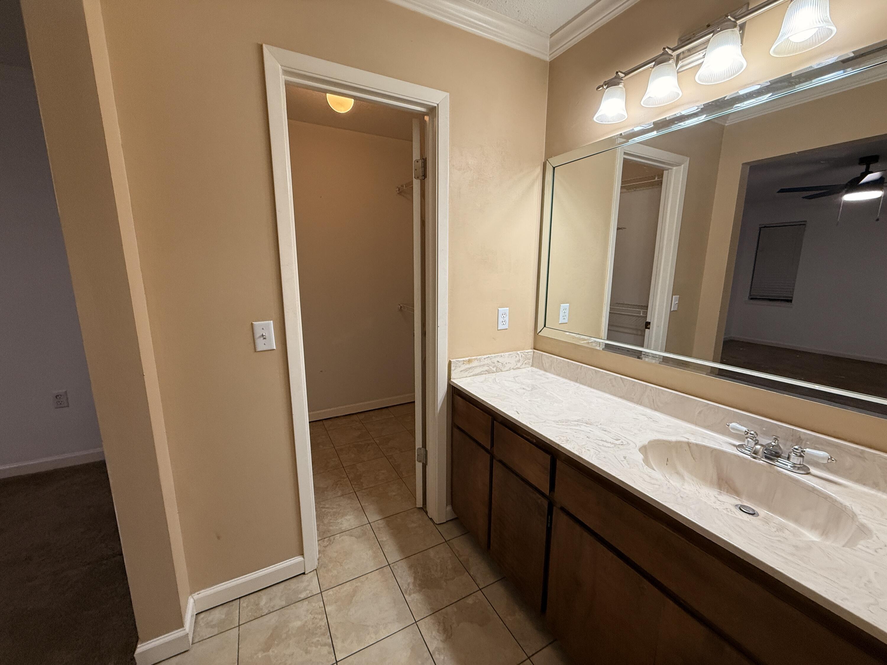 1054 9th Street Shalimar, FL 32579 - Photo 29 of 45 a bathroom with a sink and a mirror