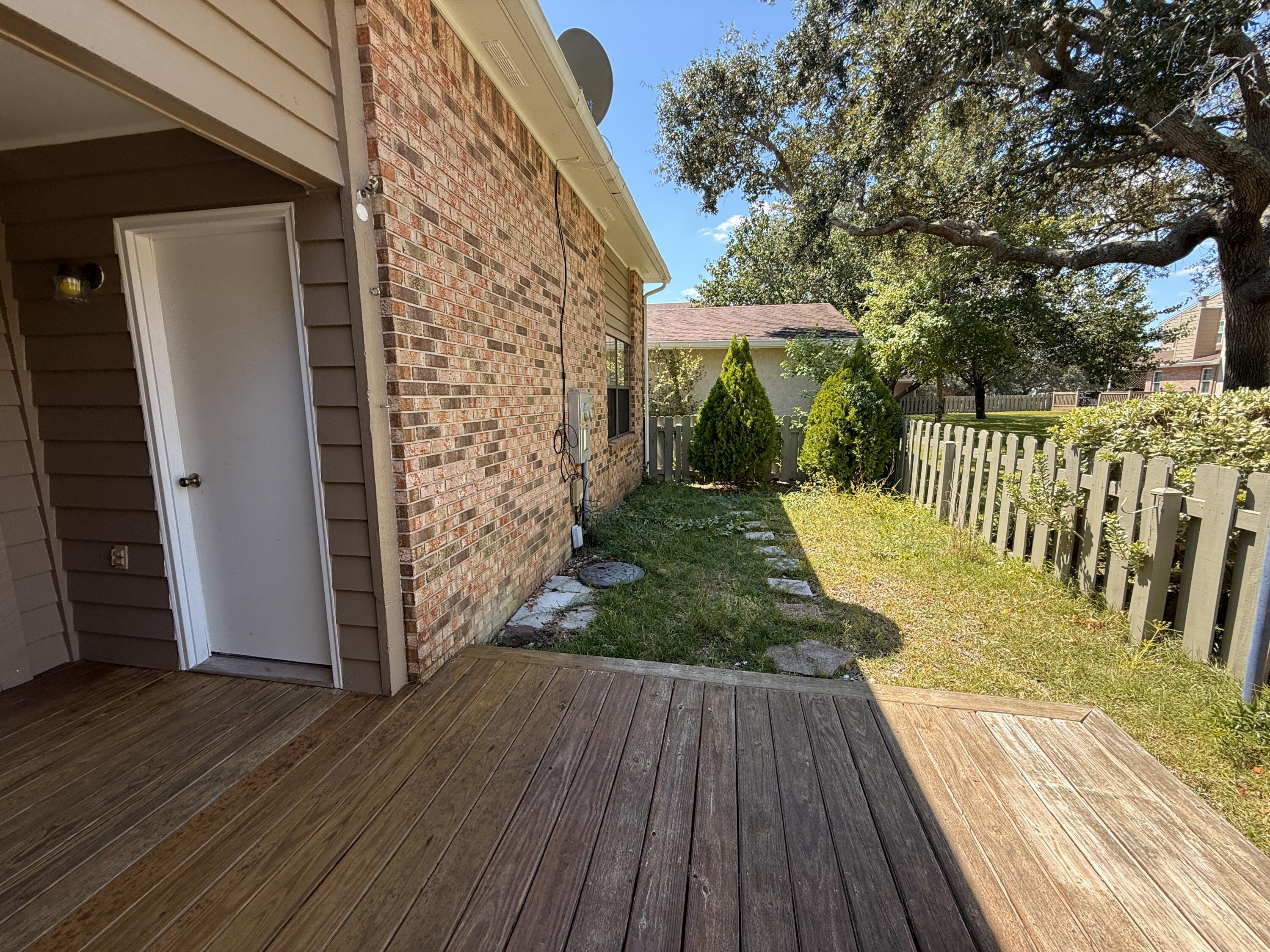 1054 9th Street Shalimar, FL 32579 - Photo 34 of 45 a view of a backyard with wooden floor and fence