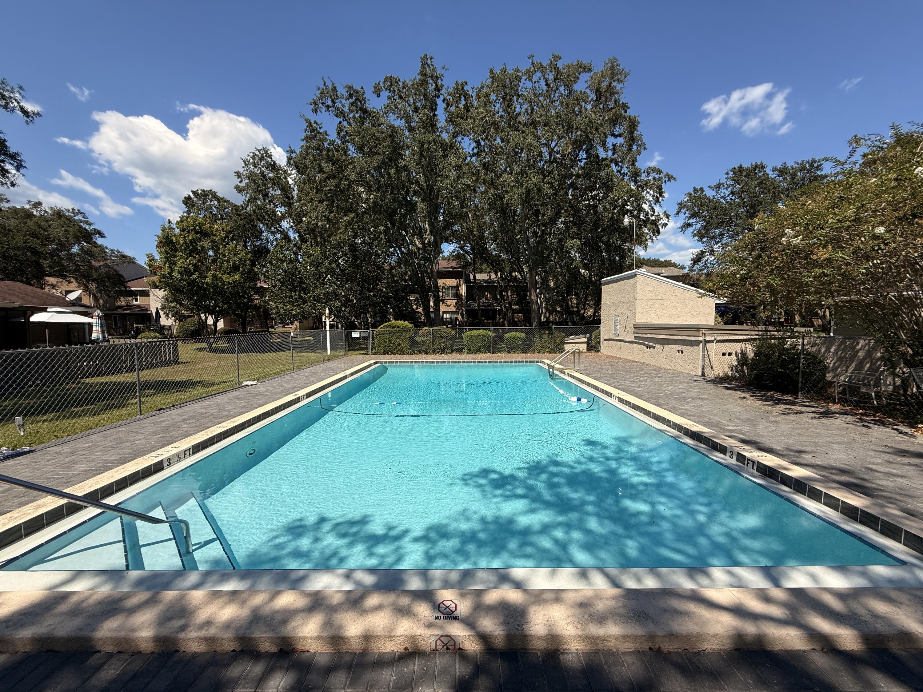 1054 9th Street Shalimar, FL 32579 - Photo 38 of 45 a view of a backyard with swimming pool