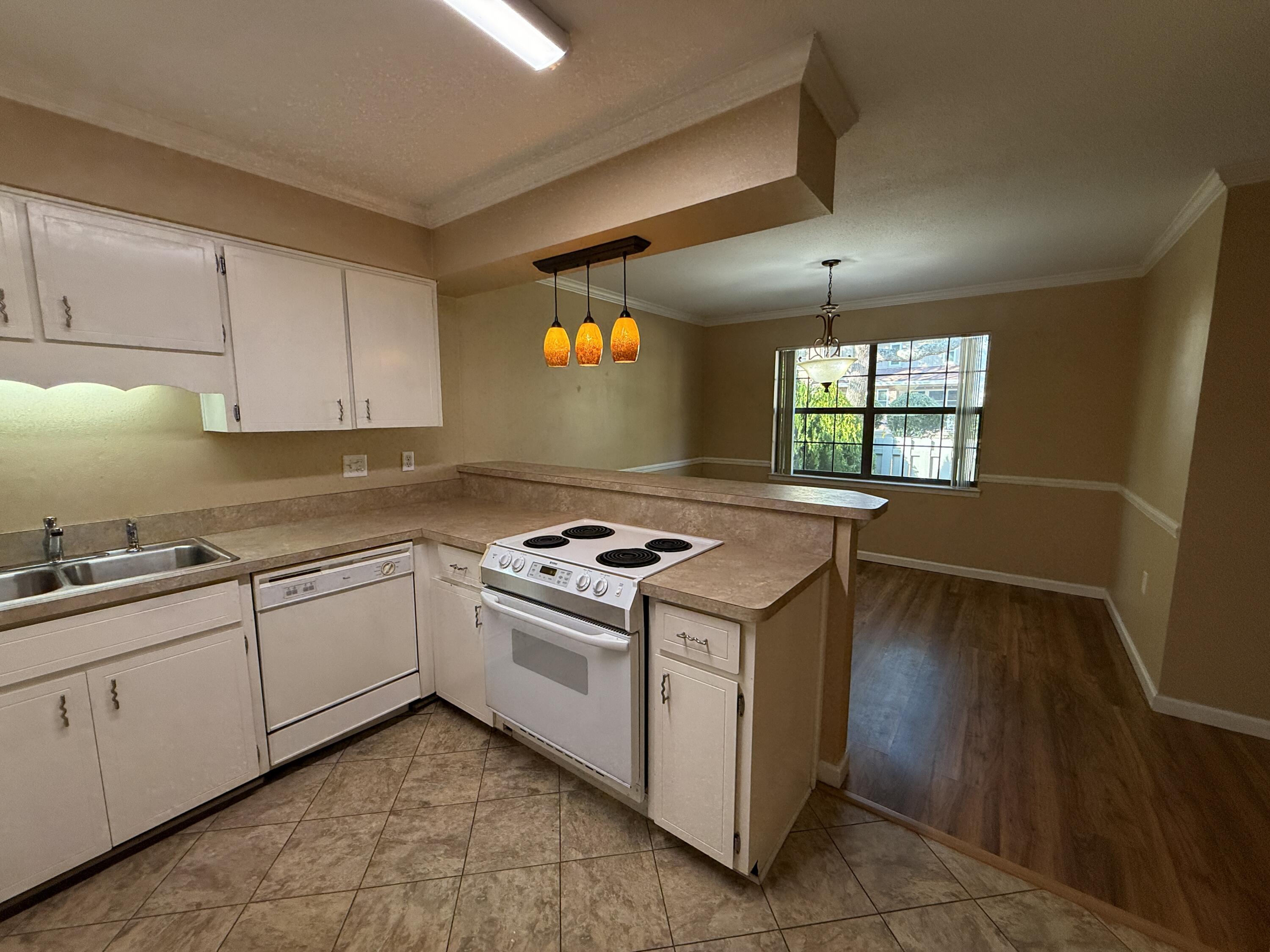 1054 9th Street Shalimar, FL 32579 - Photo 9 of 45 a kitchen with a stove and a sink