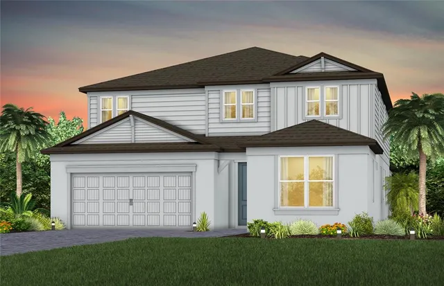 a front view of a house with a garden and plants