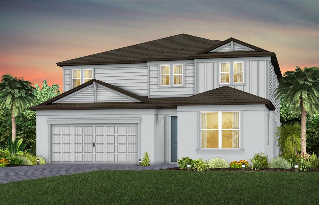 a front view of a house with a garden and plants