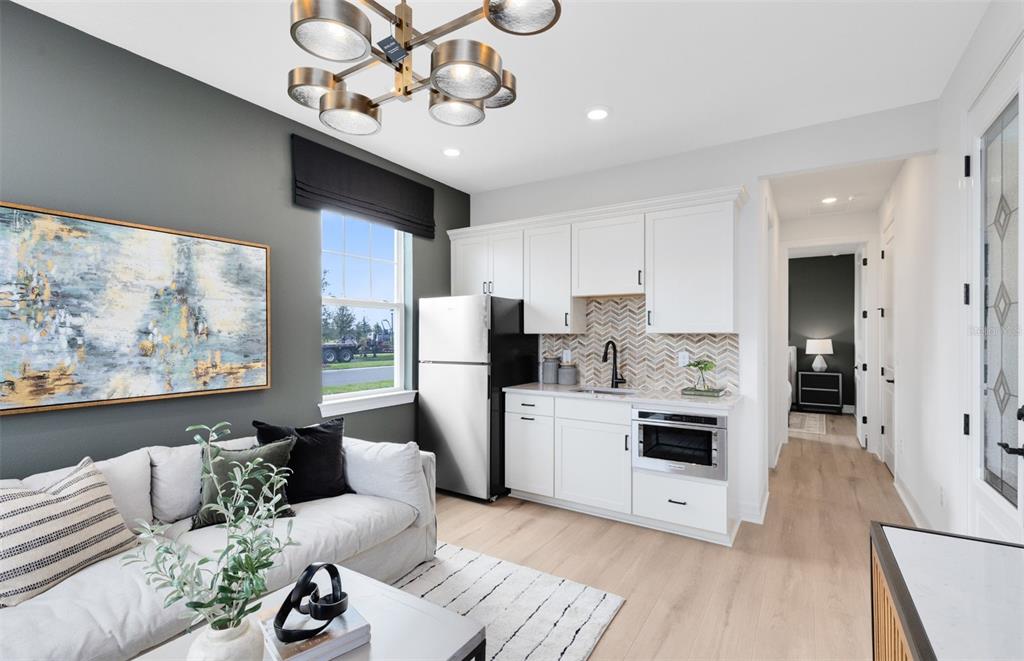 9821 Autumn Rdg Avenue Riverview, FL 33578 - Photo 7 of 30 a living room with furniture and a flat screen tv