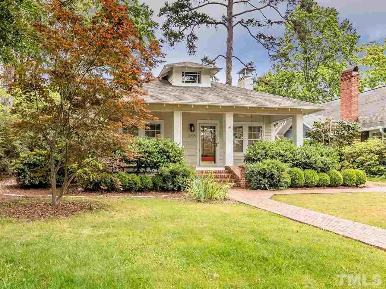 2215 The Circle Raleigh, NC 27608 - Photo 1 of 30 a front view of a house with a yard