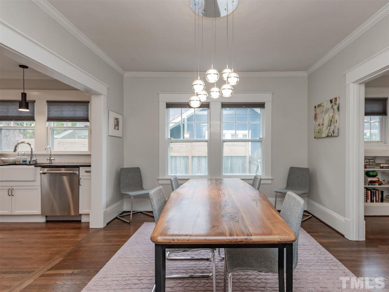 2215 The Circle Raleigh, NC 27608 - Photo 13 of 30 a view of a dining room with furniture window and wooden floor