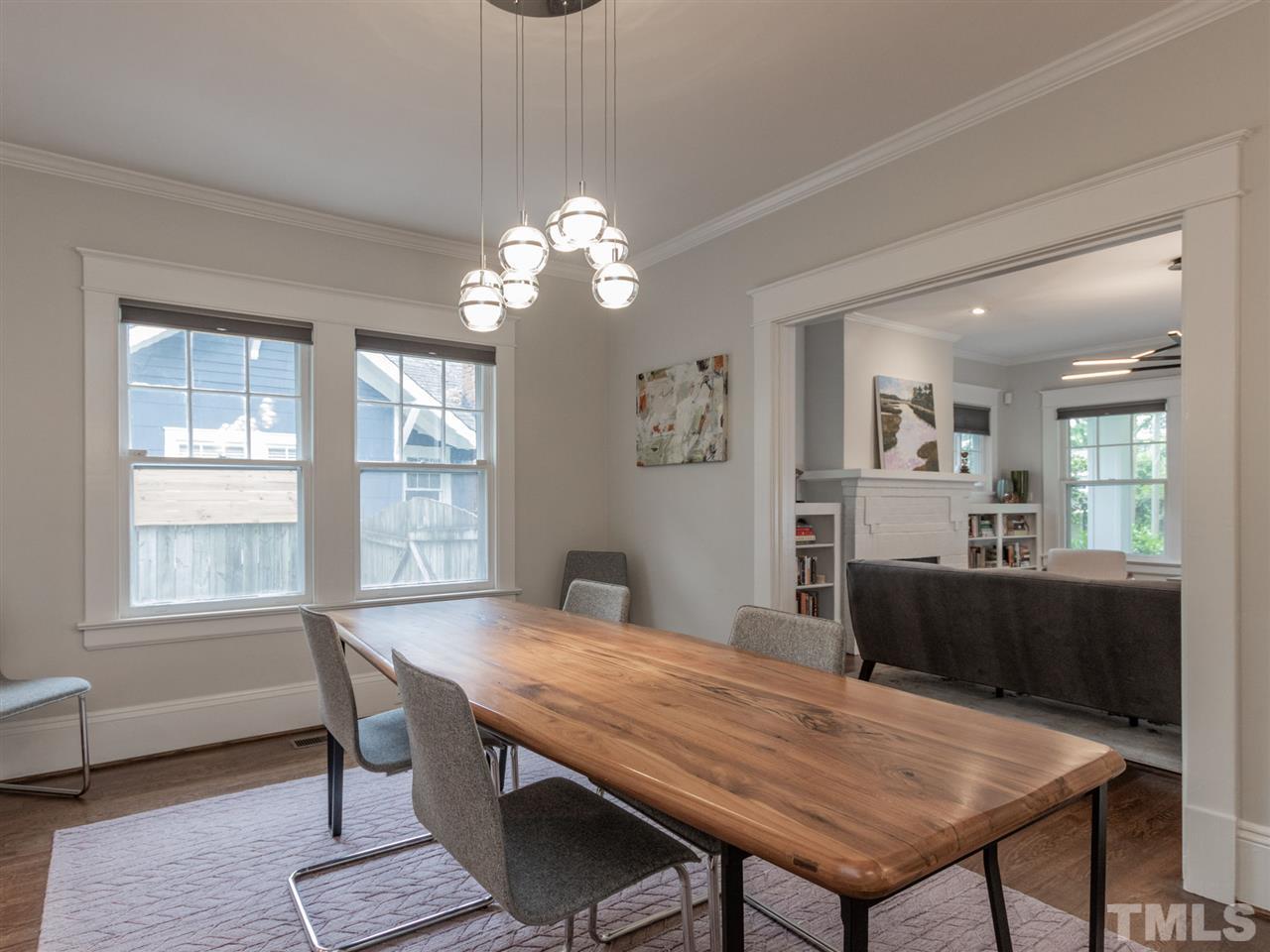 2215 The Circle Raleigh, NC 27608 - Photo 14 of 30 a view of a dining room with furniture window and wooden floor