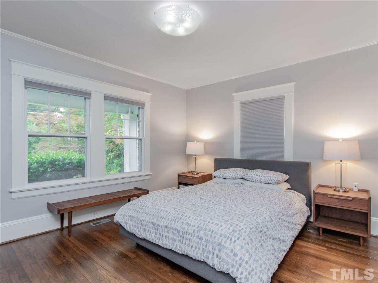 2215 The Circle Raleigh, NC 27608 - Photo 22 of 30 a bedroom with a bed and a window