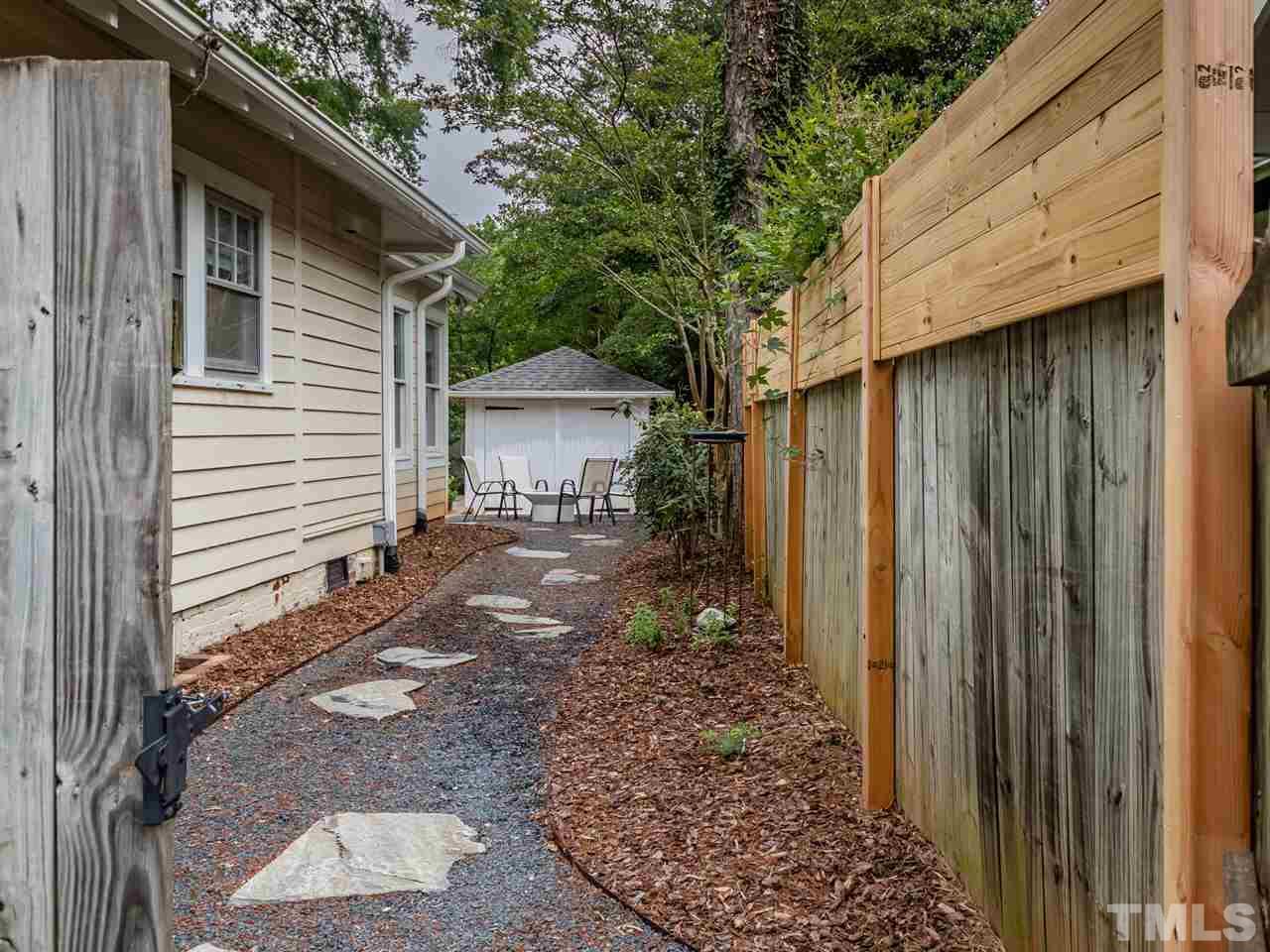 2215 The Circle Raleigh, NC 27608 - Photo 27 of 30 a view of a house with a yard