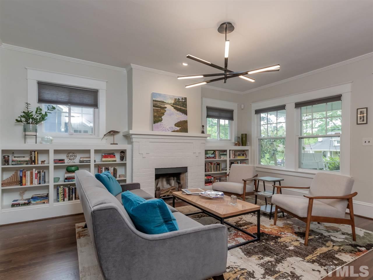 2215 The Circle Raleigh, NC 27608 - Photo 4 of 30 a living room with furniture fireplace and a large window
