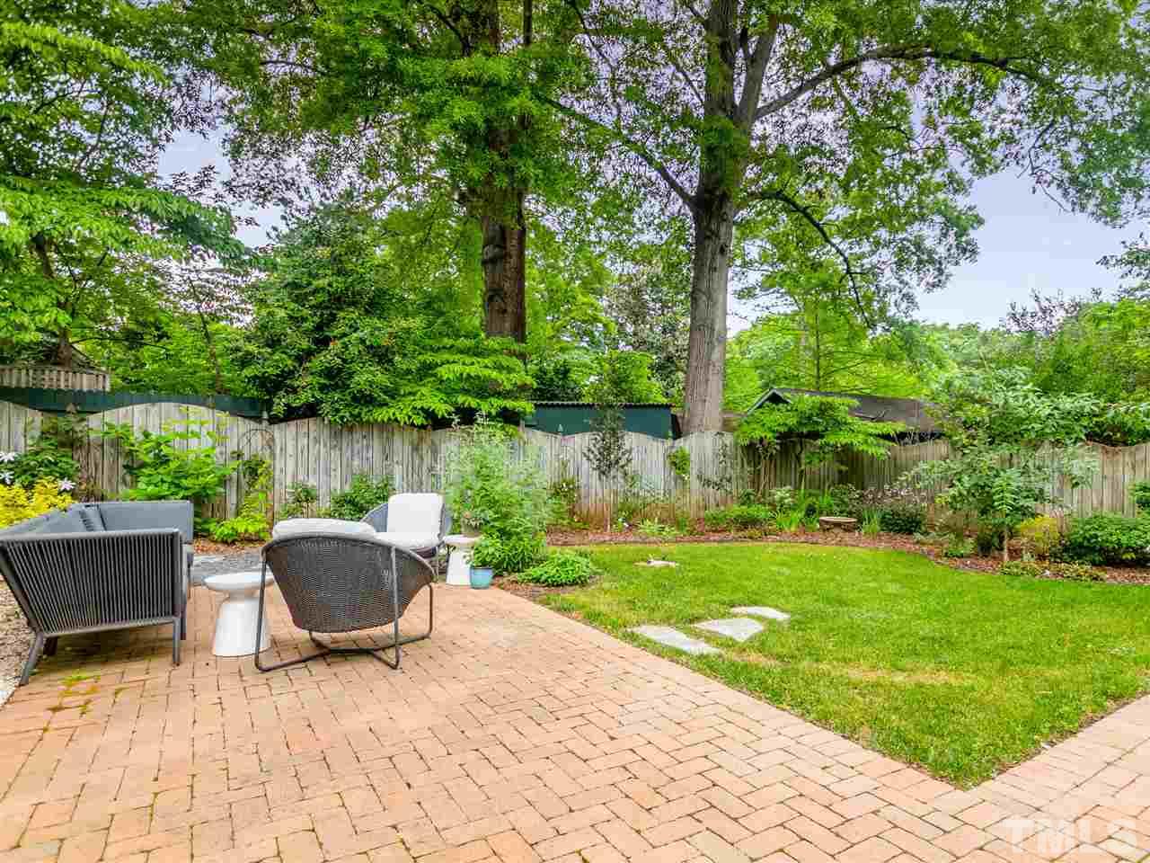 2215 The Circle Raleigh, NC 27608 - Photo 6 of 30 a backyard of a house with outdoor seating