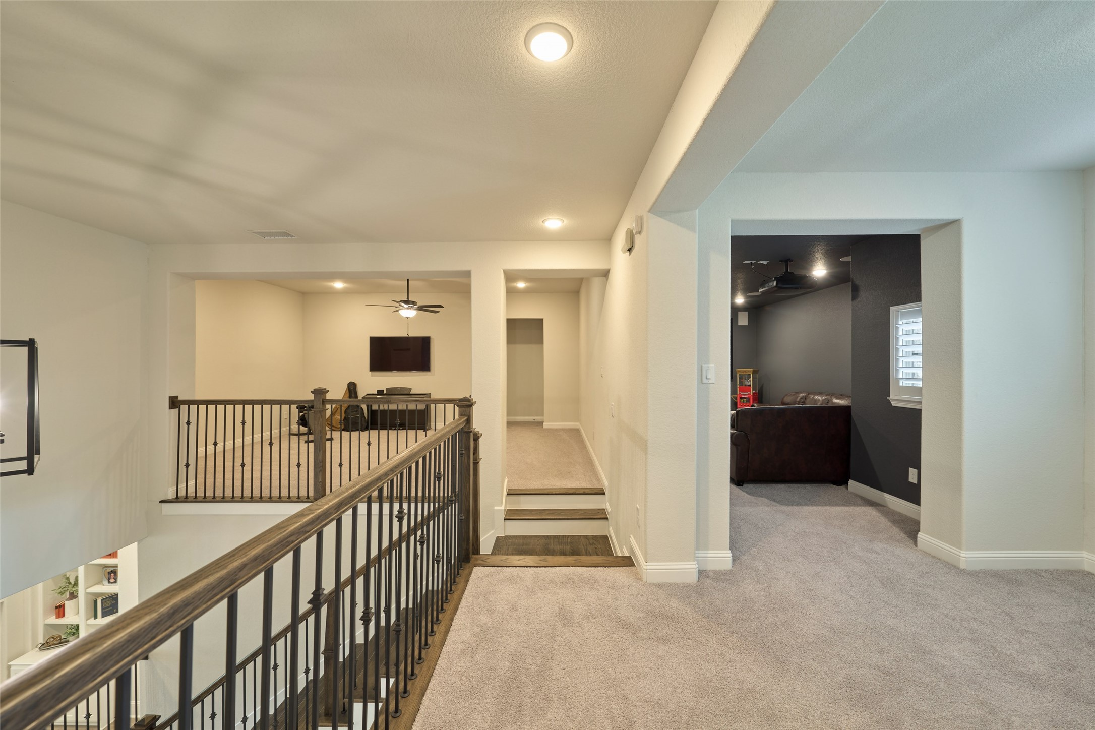 10090 South Goshawk Trail Conroe, TX 77385 - Photo 25 of 43 Landing at top of stairs with room for second office or study area, large game room on left and media room on right.