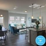 1110 Longitude Drive Durham, NC 27713 - Photo 2 of 12 a kitchen with kitchen island granite countertop a table chairs sink and cabinets