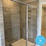 1110 Longitude Drive Durham, NC 27713 - Photo 6 of 12 a bathroom with a glass shower door