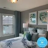 a bedroom with bed and a window