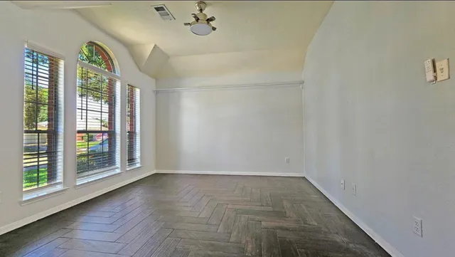 a spacious bathroom with a double vanity sink and a mirror