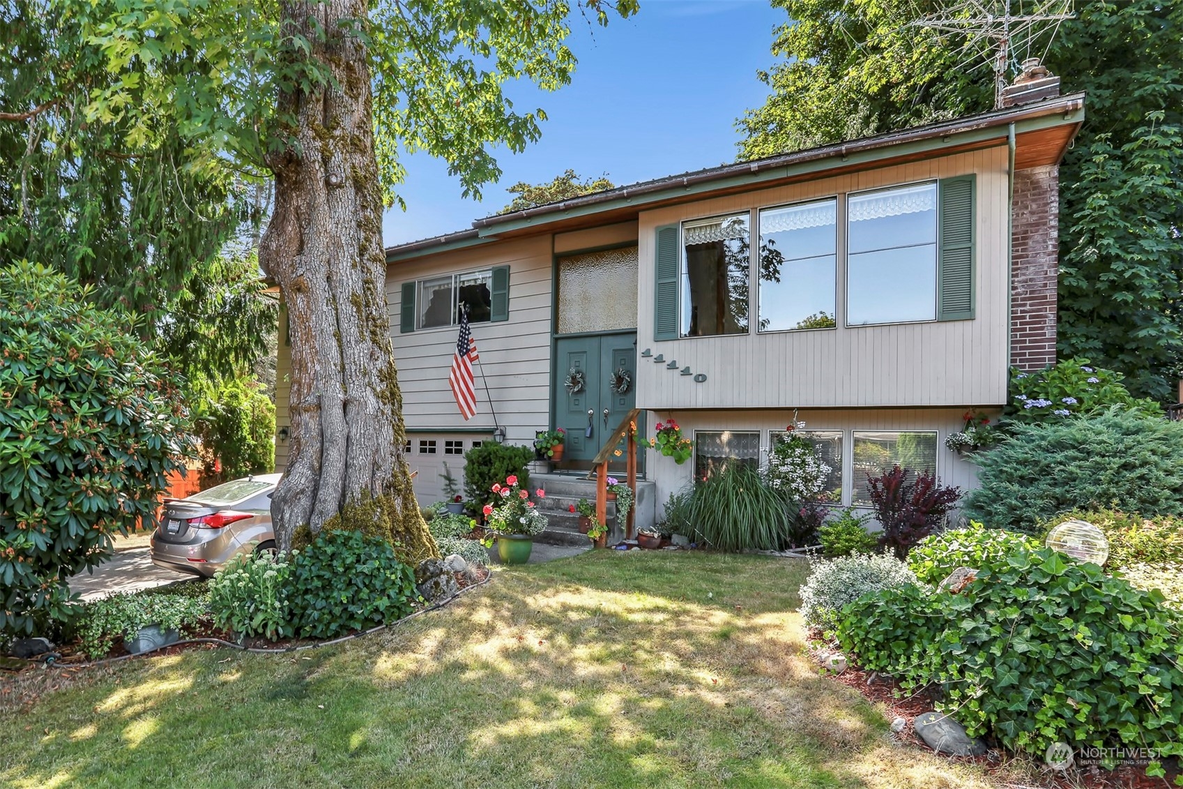 a front view of a house with garden