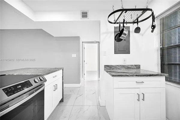 a view of a hallway with wooden shelves