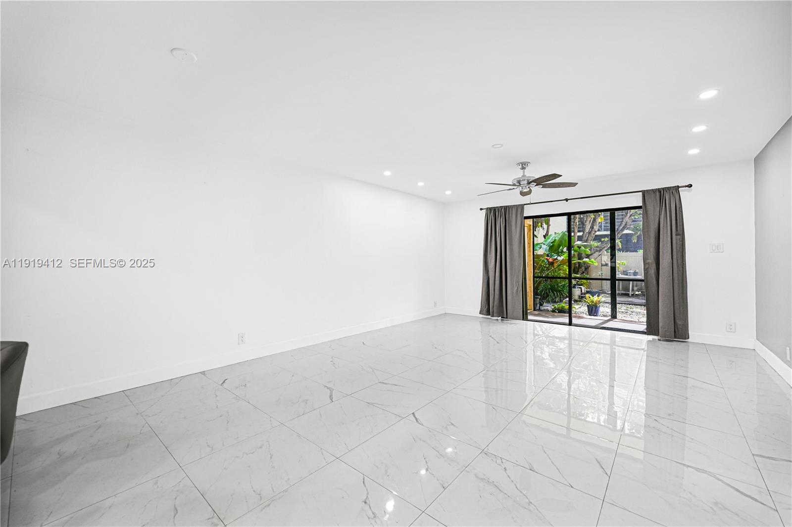 132 South Cypress Road, Unit 518 Pompano Beach, FL 33060 - Photo 13 of 60 a view of an empty room with a window