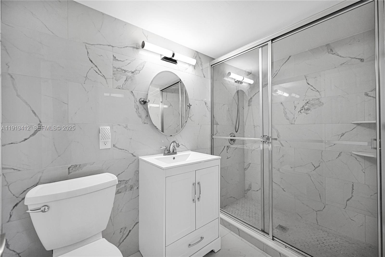 132 South Cypress Road, Unit 518 Pompano Beach, FL 33060 - Photo 19 of 60 a bathroom with a toilet sink and shower