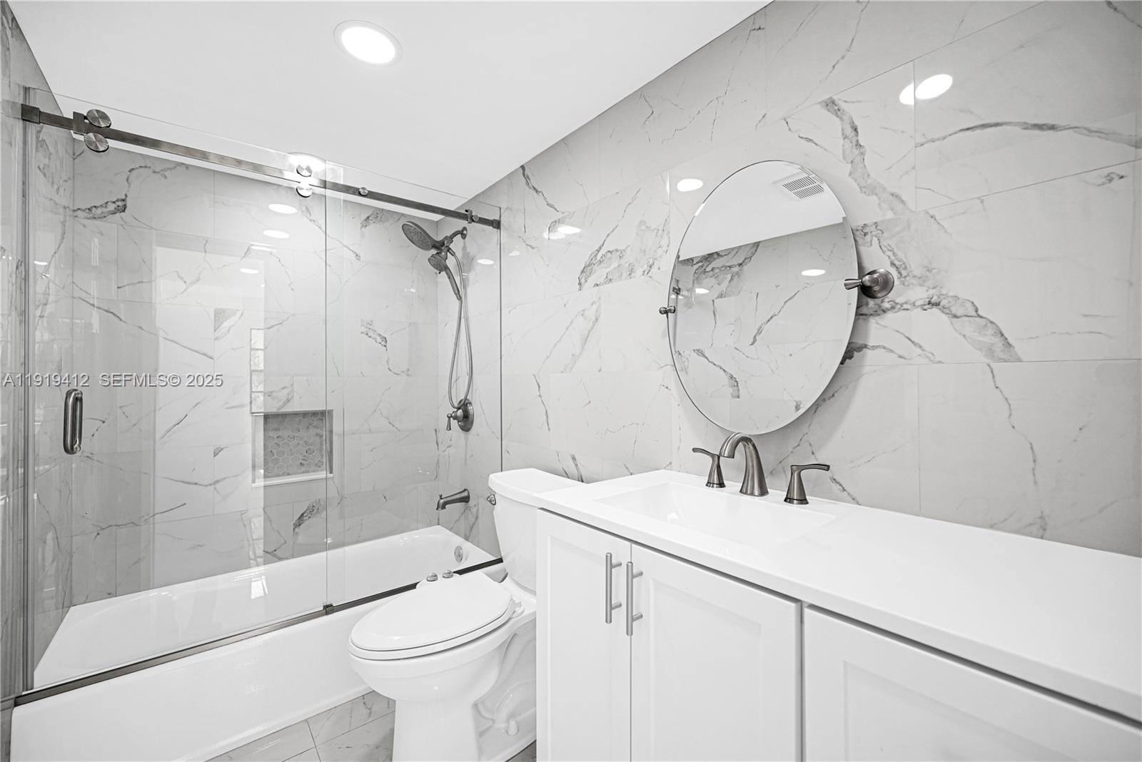 132 South Cypress Road, Unit 518 Pompano Beach, FL 33060 - Photo 25 of 60 a bathroom with a sink a toilet and shower