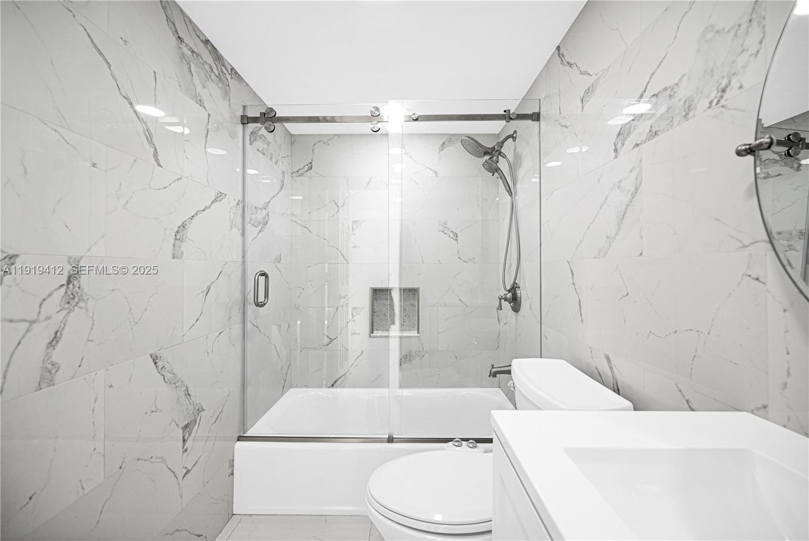 132 South Cypress Road, Unit 518 Pompano Beach, FL 33060 - Photo 27 of 60 a bathroom with a toilet and a shower