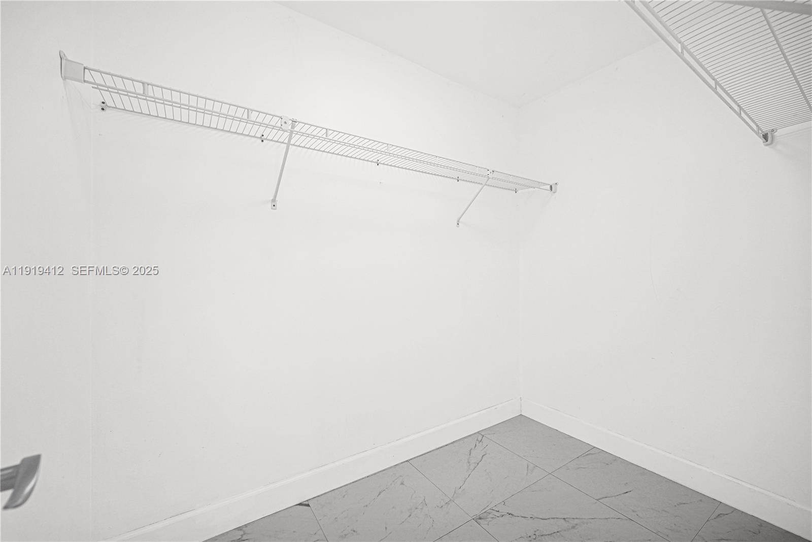 132 South Cypress Road, Unit 518 Pompano Beach, FL 33060 - Photo 28 of 60 a view of a rack on the wall