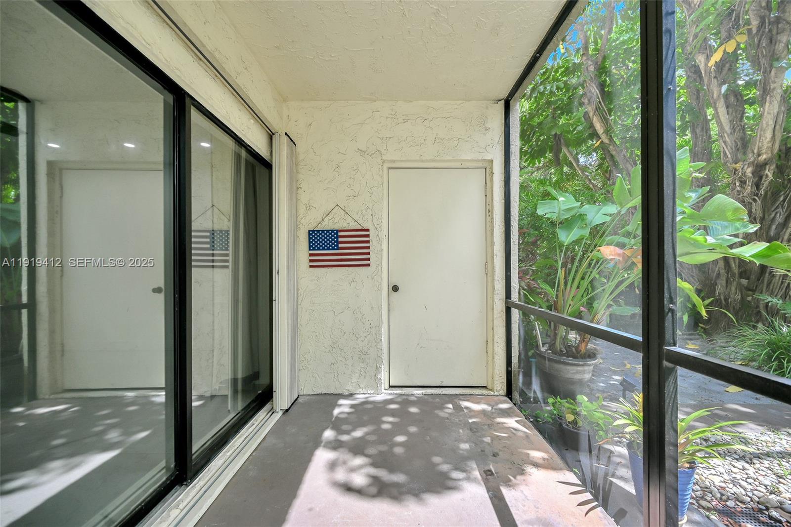 132 South Cypress Road, Unit 518 Pompano Beach, FL 33060 - Photo 32 of 60 a view of a glass door and the balcony