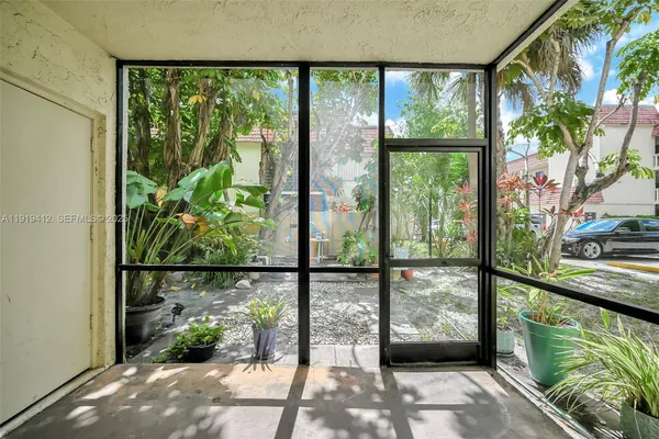 a plant that is in front of a door