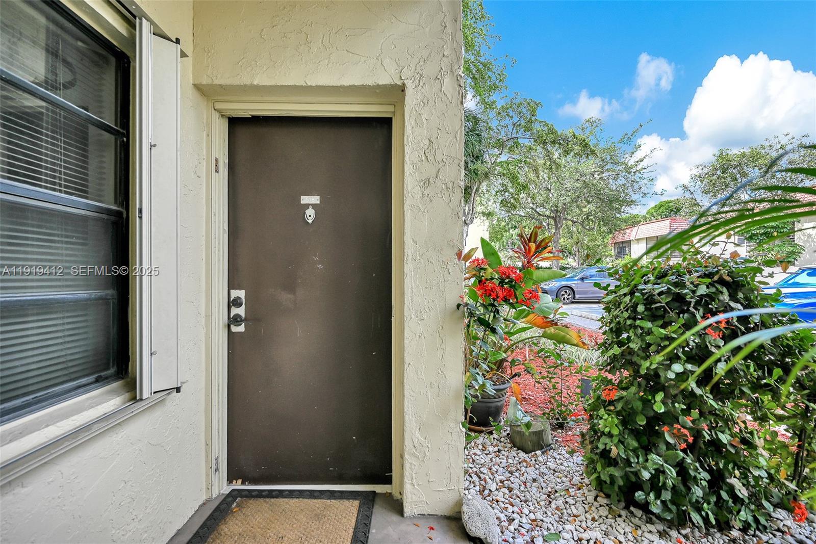 132 South Cypress Road, Unit 518 Pompano Beach, FL 33060 - Photo 39 of 60 a plant that is in front of a door