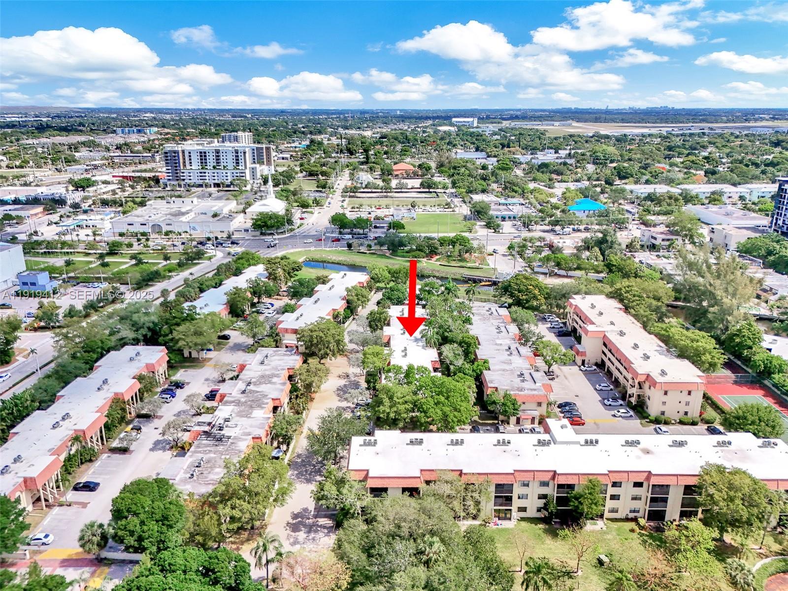 132 South Cypress Road, Unit 518 Pompano Beach, FL 33060 - Photo 42 of 60 an aerial view of residential houses with outdoor space