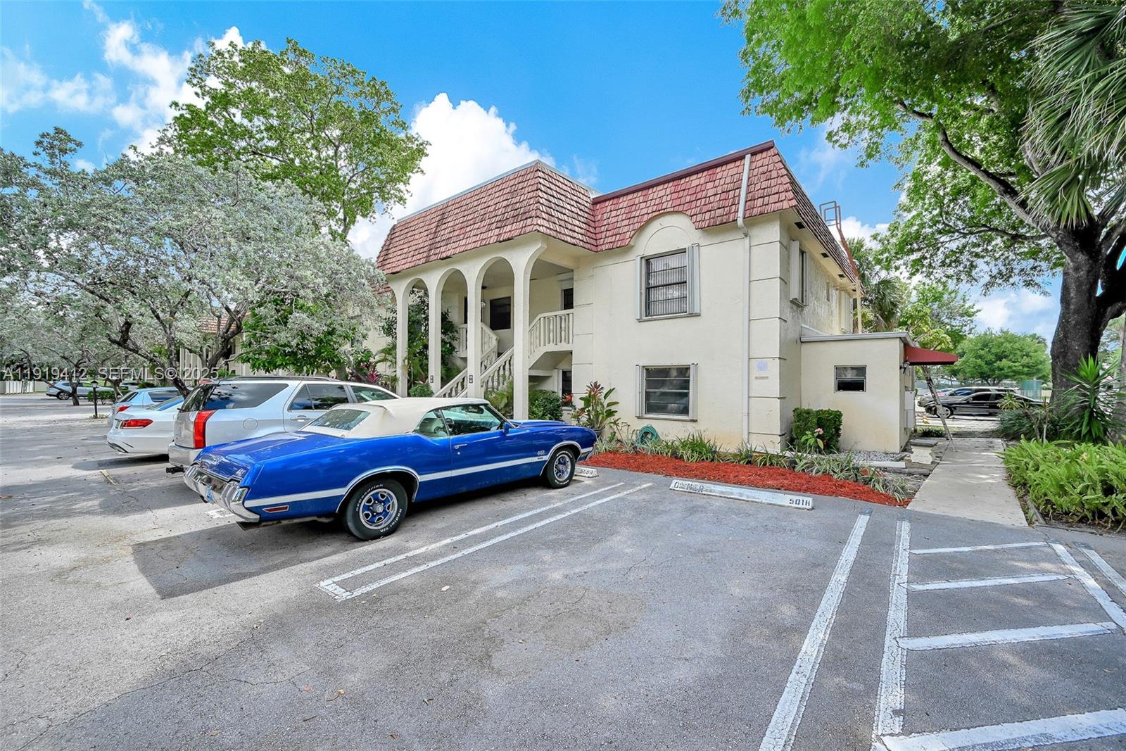 132 South Cypress Road, Unit 518 Pompano Beach, FL 33060 - Photo 57 of 60 a front view of a house with a yard