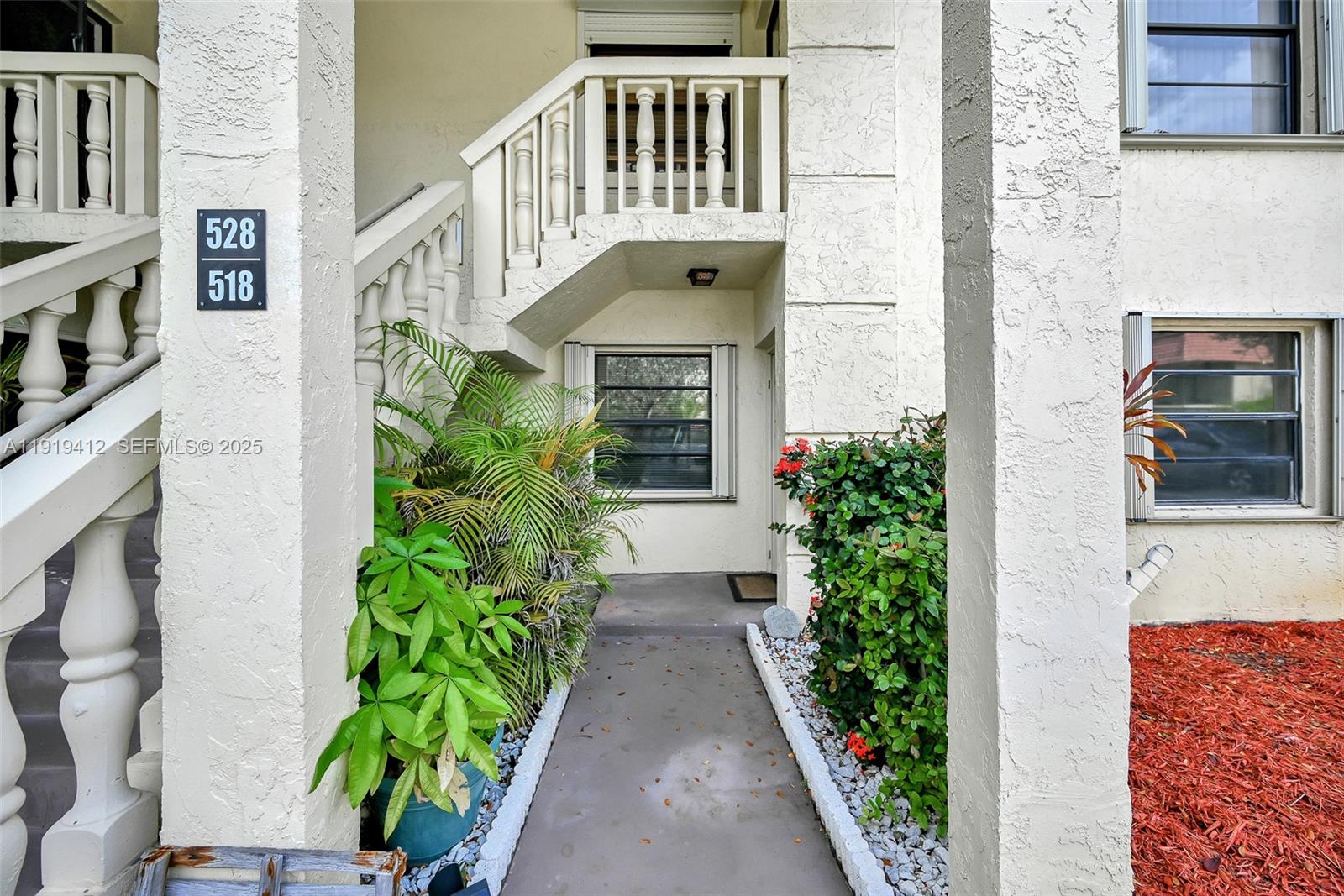 132 South Cypress Road, Unit 518 Pompano Beach, FL 33060 - Photo 60 of 60 a front view of a house with garden