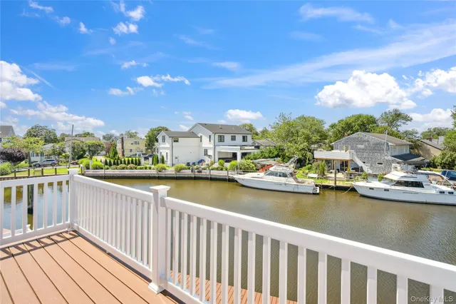 a view of a lake with boats and trees in the background