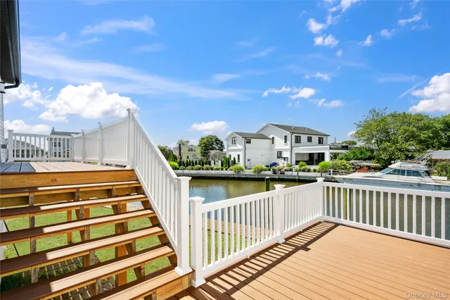 a view of balcony with wooden floor