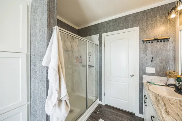 a bathroom with a tub and shower