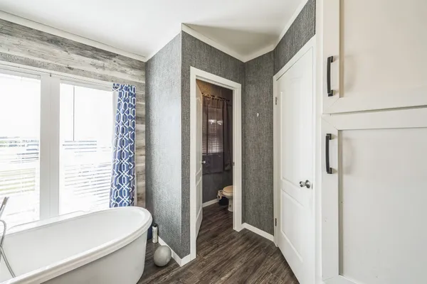a room with a bed and a window