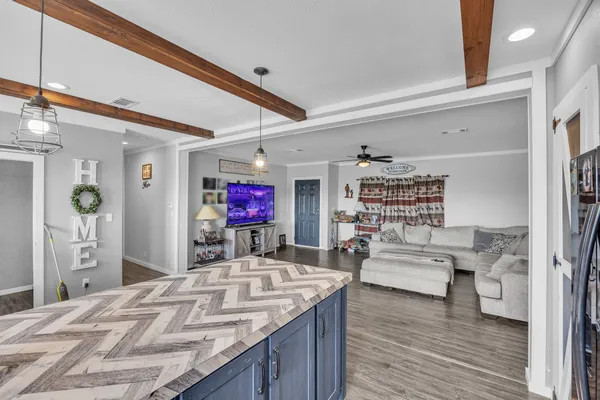 a view of living room kitchen and dining room