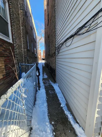 a view of a backyard with table and chairs