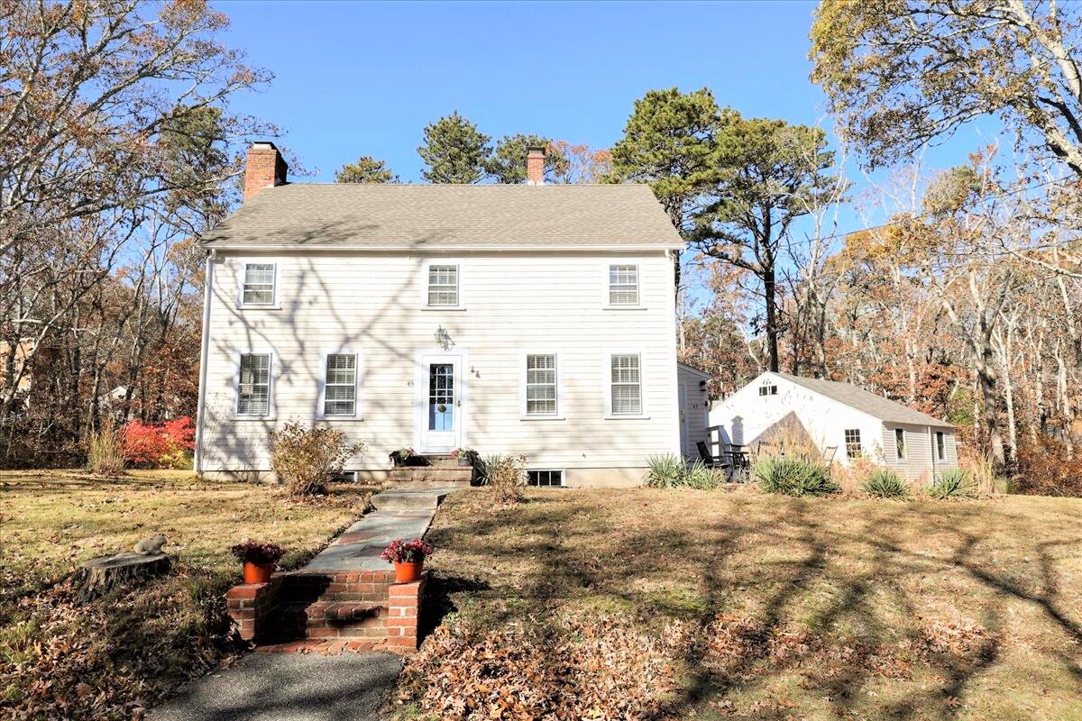 45 Cottontail Road Wellfleet, MA 02667 - Photo 1 of 44 a front view of a house with a yard