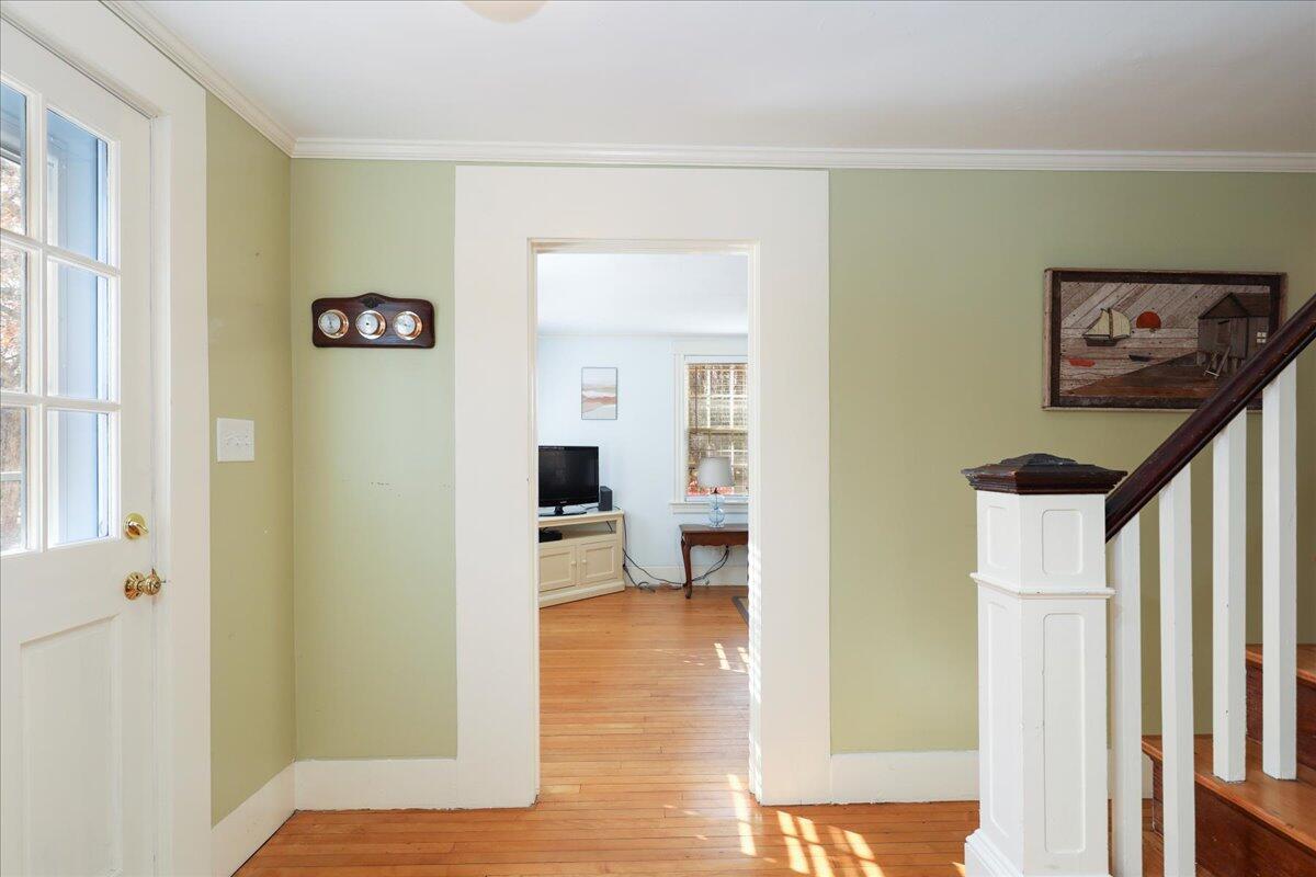 45 Cottontail Road Wellfleet, MA 02667 - Photo 11 of 44 a view of a hallway with wooden floor and a living room