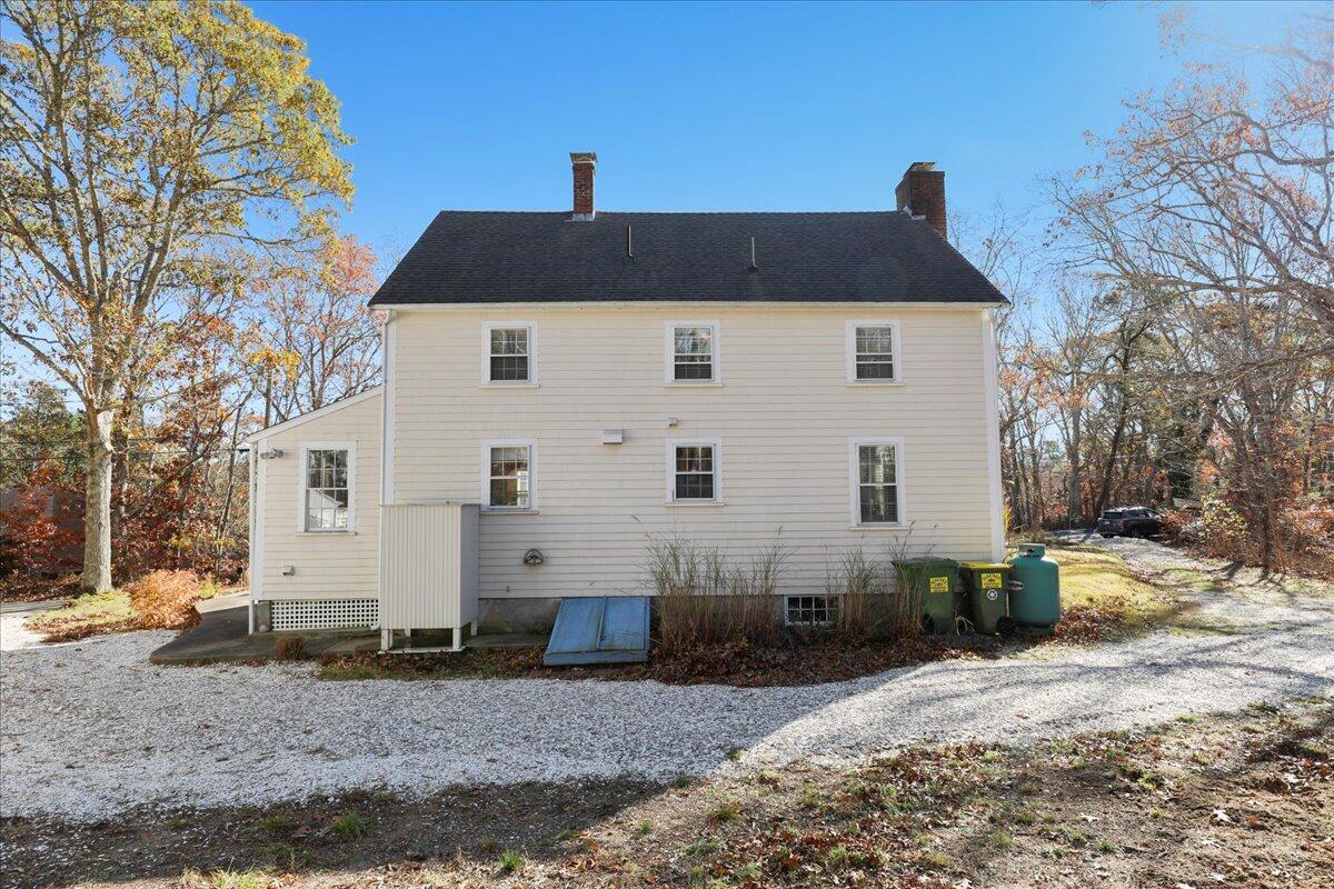 45 Cottontail Road Wellfleet, MA 02667 - Photo 27 of 44 a front view of a house with a yard