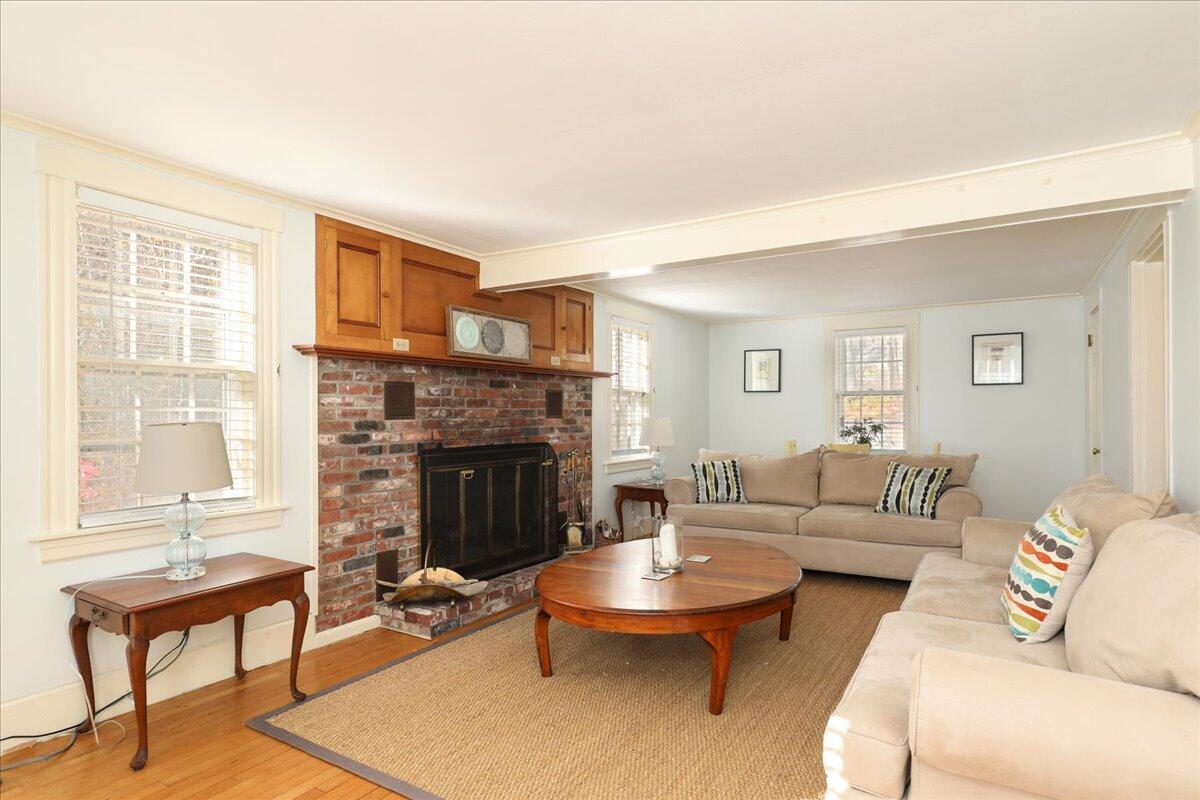 45 Cottontail Road Wellfleet, MA 02667 - Photo 4 of 44 a living room with furniture a fireplace and next to a window