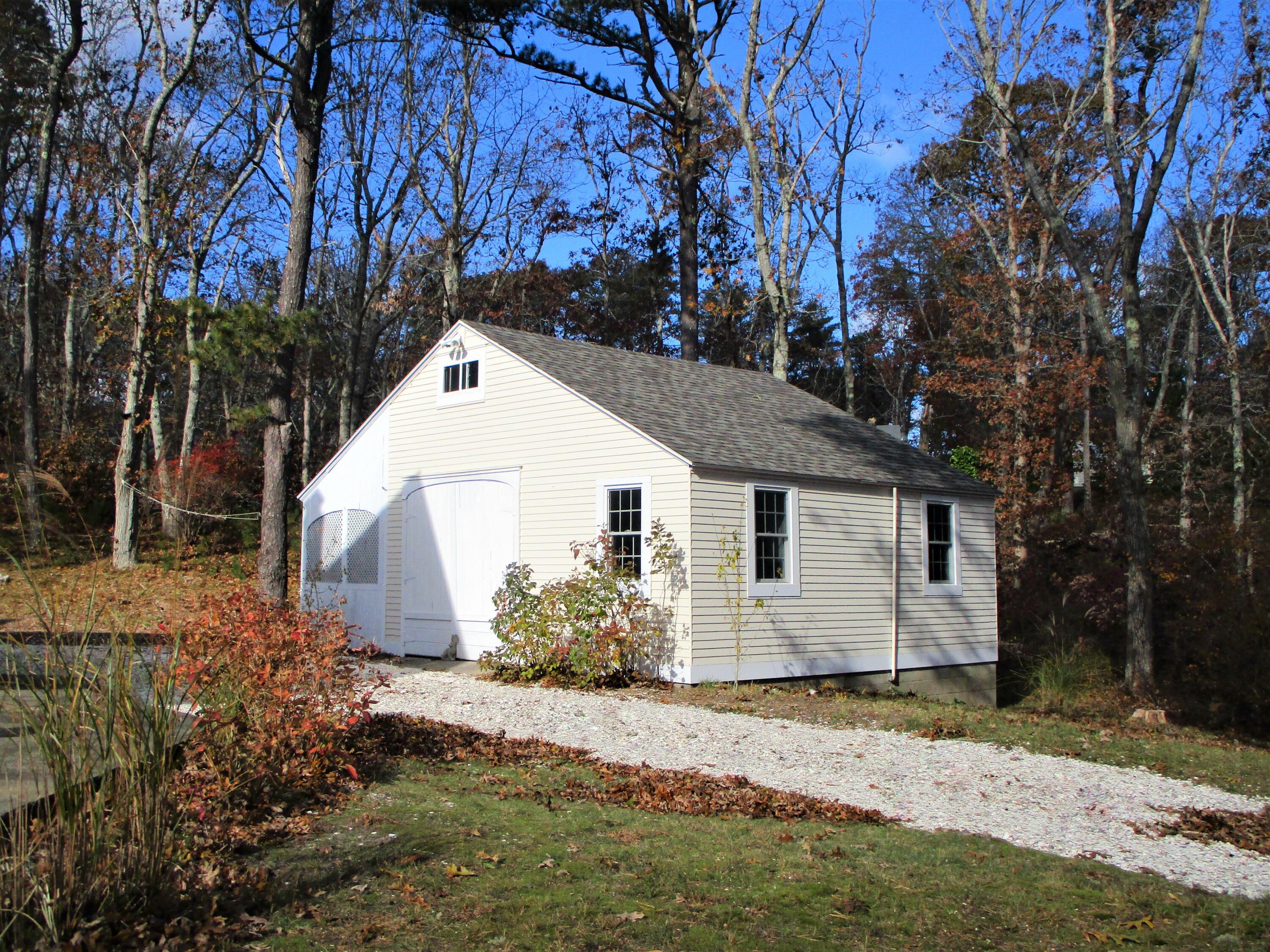 45 Cottontail Road Wellfleet, MA 02667 - Photo 39 of 44 a view of a white house with a yard