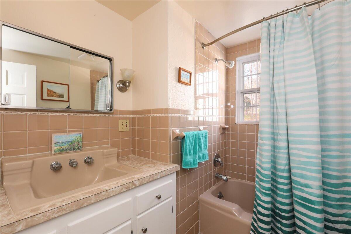 45 Cottontail Road Wellfleet, MA 02667 - Photo 8 of 44 a bathroom with a granite countertop tub a sink and a shower