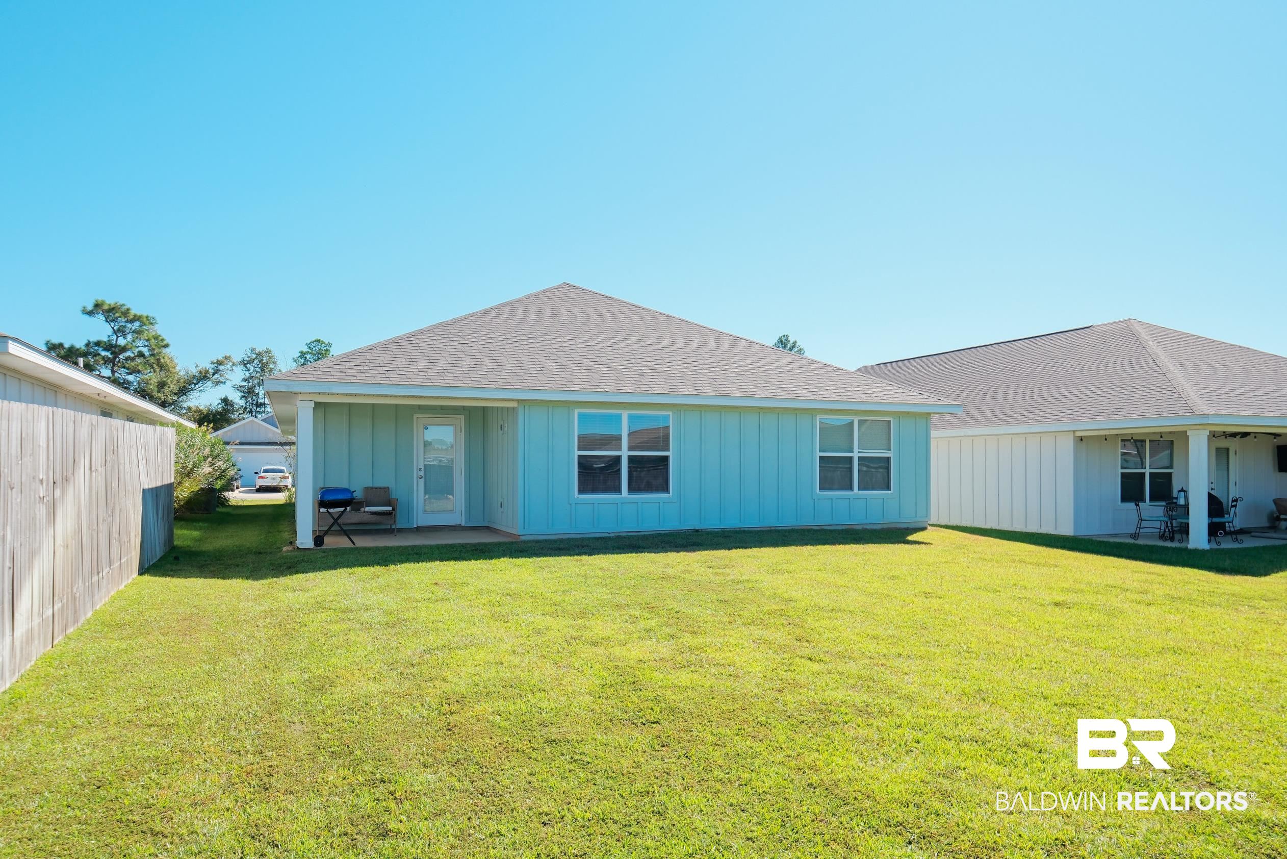 7425 Coppin Drive Foley, AL 36535 - Photo 36 of 41 Back of property with a yard and a patio