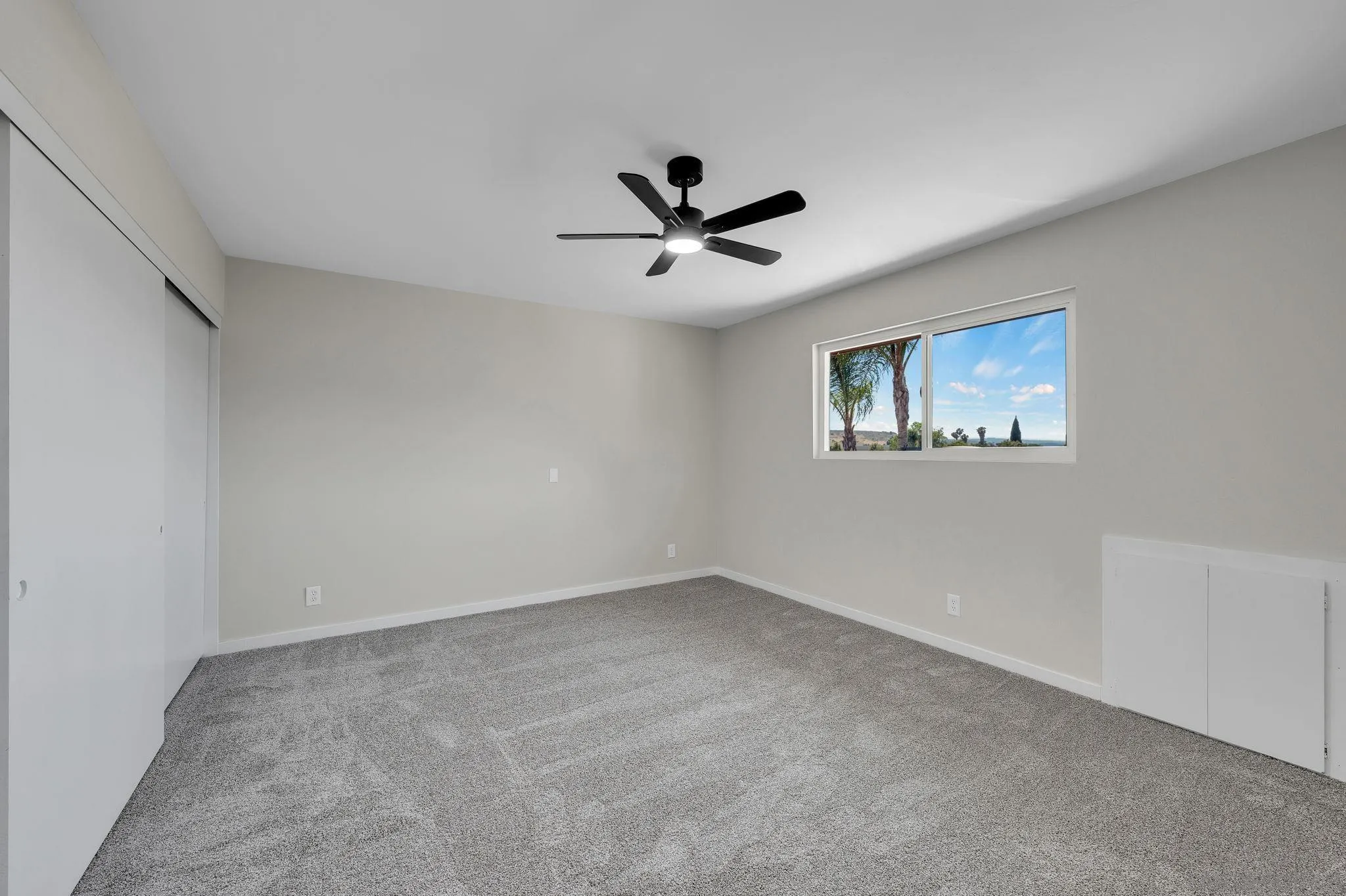 13322 Via Mark Poway, CA 92064 - Photo 20 of 25 a view of a livingroom with a ceiling fan and window