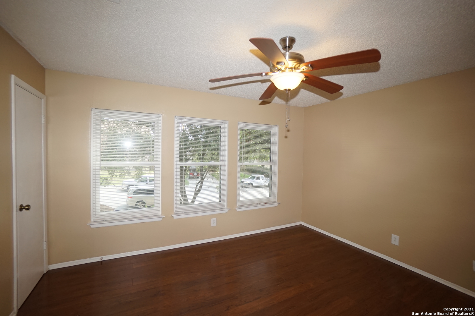 811 Meadow Scape Converse, TX 78109 - Photo 15 of 19 a view of an empty room with window and a fan