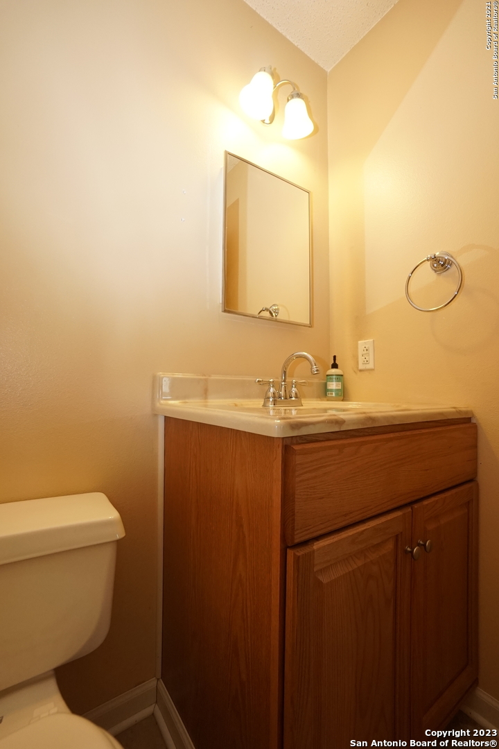 811 Meadow Scape Converse, TX 78109 - Photo 9 of 19 a bathroom with a sink toilet and mirror