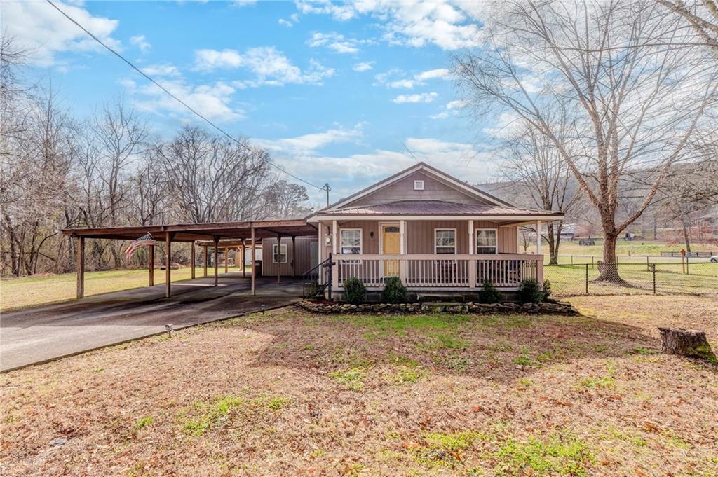 a view of a house with a yard
